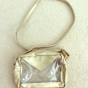 Stadium Crossbody bag Gold accents